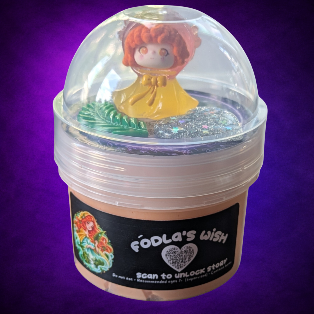 Fódla’s Wish peach-coloured slime in its labelled jar with a clear dome lid and woodland charms.