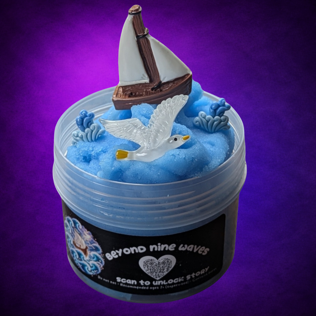 Beyond Nine Waves blue Icee slime topped with a sailboat, white seagull and blue wave charms.