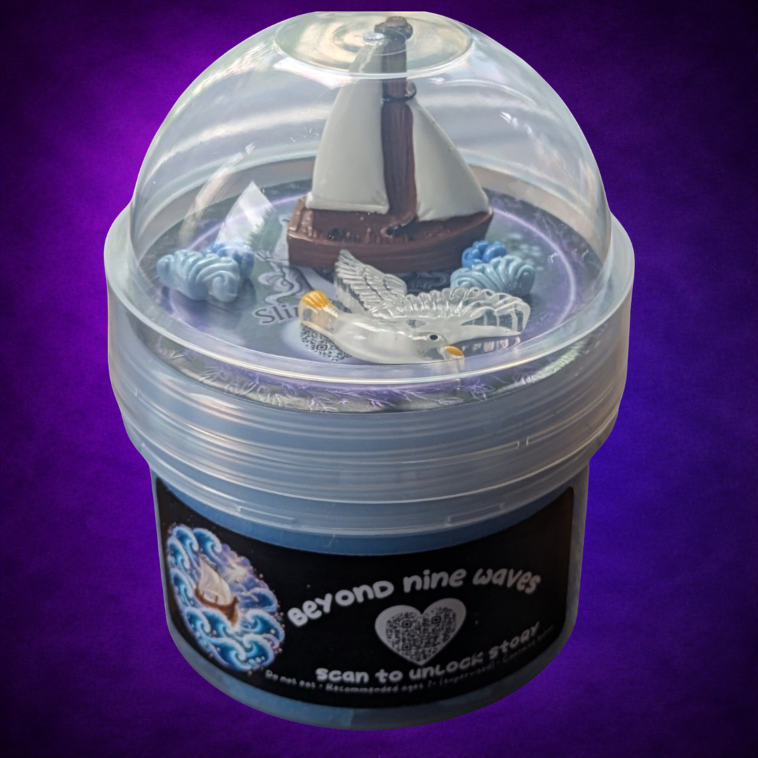 Beyond Nine Waves blue slime in its labelled jar with a clear dome lid and ocean charms.