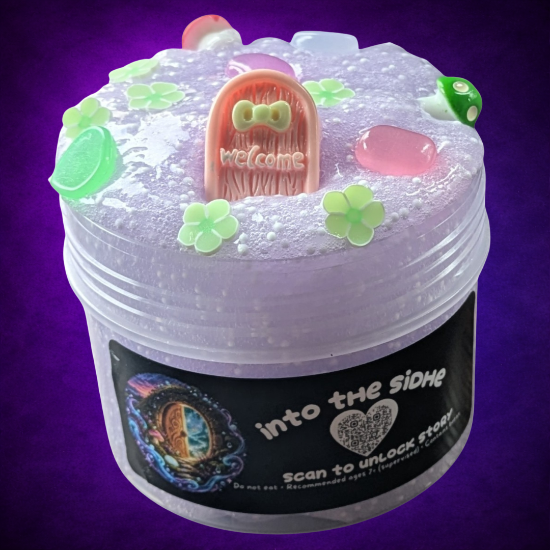Into the Sídhe light purple microfloam slime with a pink fairy door, mushrooms, green flowers and colourful pebbles.